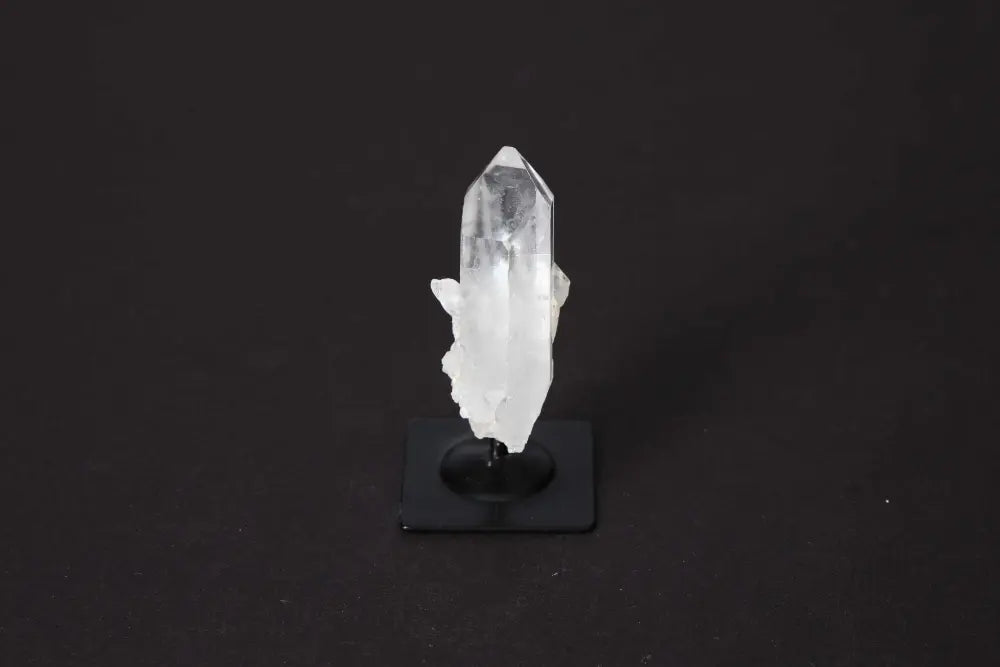 Clear Quartz on Metal Stand, "Master Healer" crystal from Sylvia Crystals, enhances energy and spirituality on elegant display.