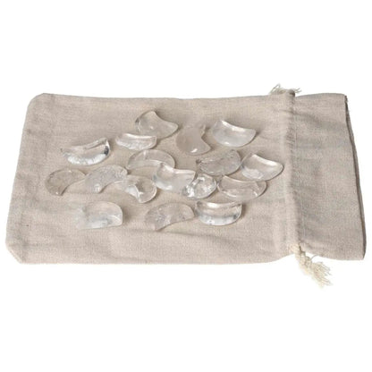 Clear Quartz small moon stones on a linen bag for purification and harmonizing energy, ideal for neutralizing negative vibrations.