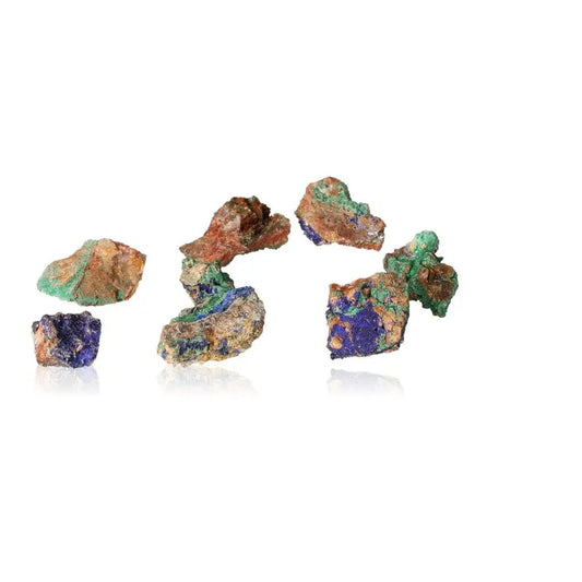 Assorted raw druzes with vibrant malachite and azurite, symbolizing nature's soothing and energizing qualities.