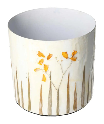 Elegant planter featuring a delicate flower motif design with neutral tones, perfect for enhancing modern living spaces.