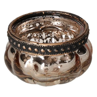 Elegant gold candle holder with a decorative black rim, reflecting luxurious craftsmanship and spiritual harmony.