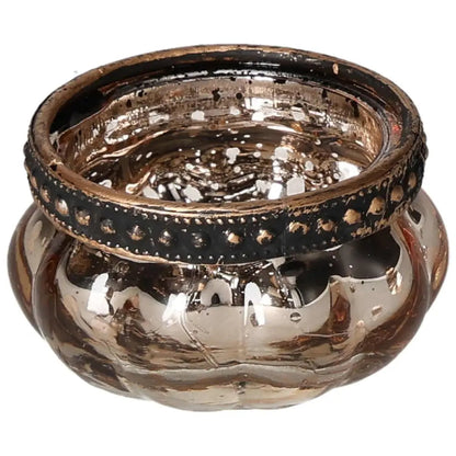 Luxurious gold candle holder with intricate designs symbolizing sophistication and serenity, enhanced with crystal elements.