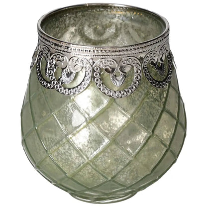 Green glass lantern by Sylvia Crystals with intricate silver detailing, reflecting luxury and nature-inspired elegance.