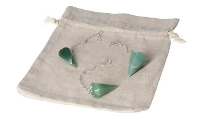 Green quartz pendulum set on a beige drawstring pouch, with silver chains, perfect for dowsing and energy healing practices.