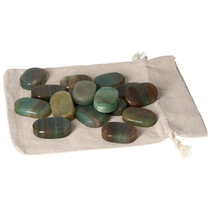 Green Quartz With Hematite Antistress Thumb Massager stones on a beige pouch, ideal for stress relief and relaxation therapy.