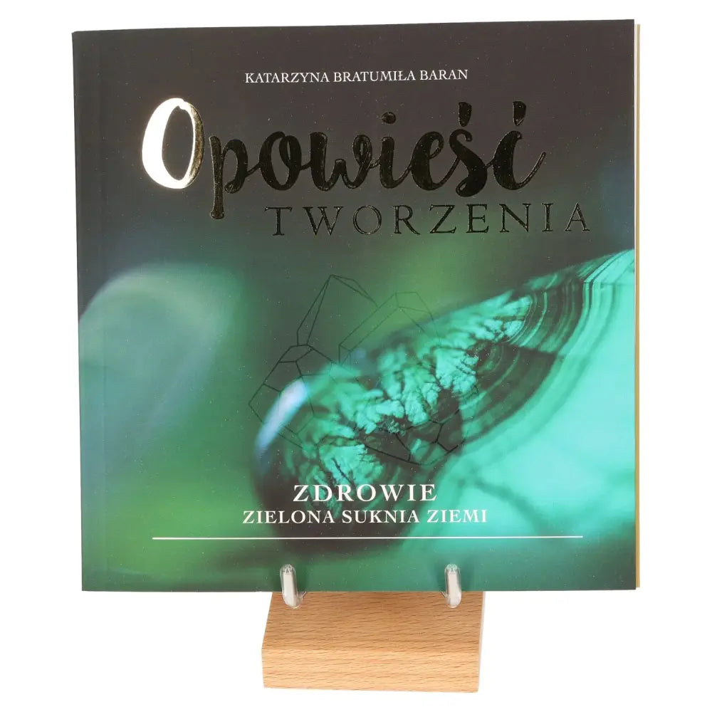 "Health: The Green Dress of the Earth" book cover displayed on a wooden stand, symbolizing nature's serene essence and wellness.