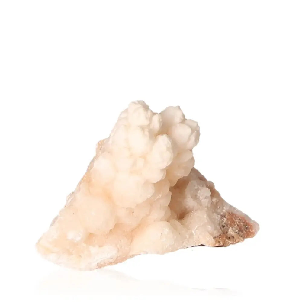 Ighoud Calcite Druze from Morocco showcasing natural shapes and earthy tones, symbolizing stability and transformation.