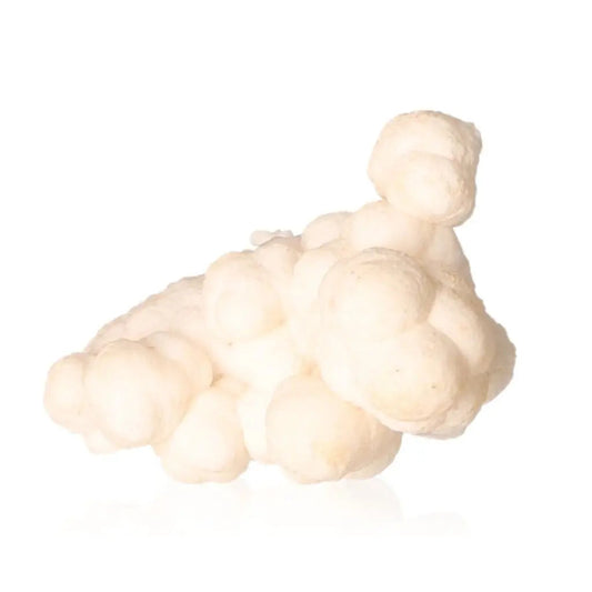 Ighoud Calcite Druze from Morocco, showcasing natural earthy shapes and warm tones, symbolizing grounding and transformation energies.