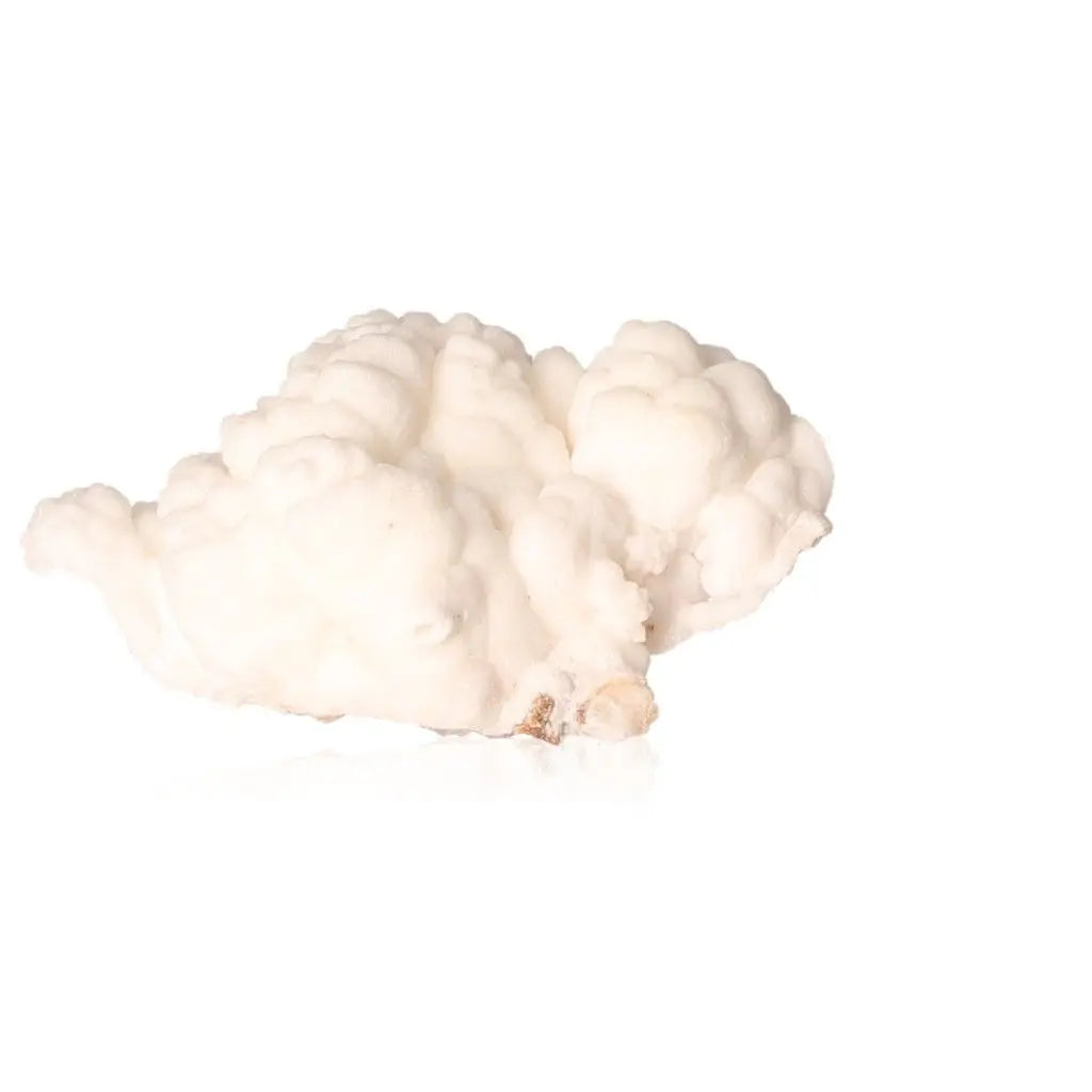 Ighoud Calcite Druze from Morocco showcasing natural shapes, warm earthy hues, and grounding energy for spiritual transformation.