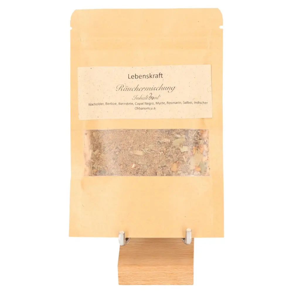 Incense Blend 'Feather Dance' with juniper, offering vitality and energy, known for purification and protection. 100g package on display.