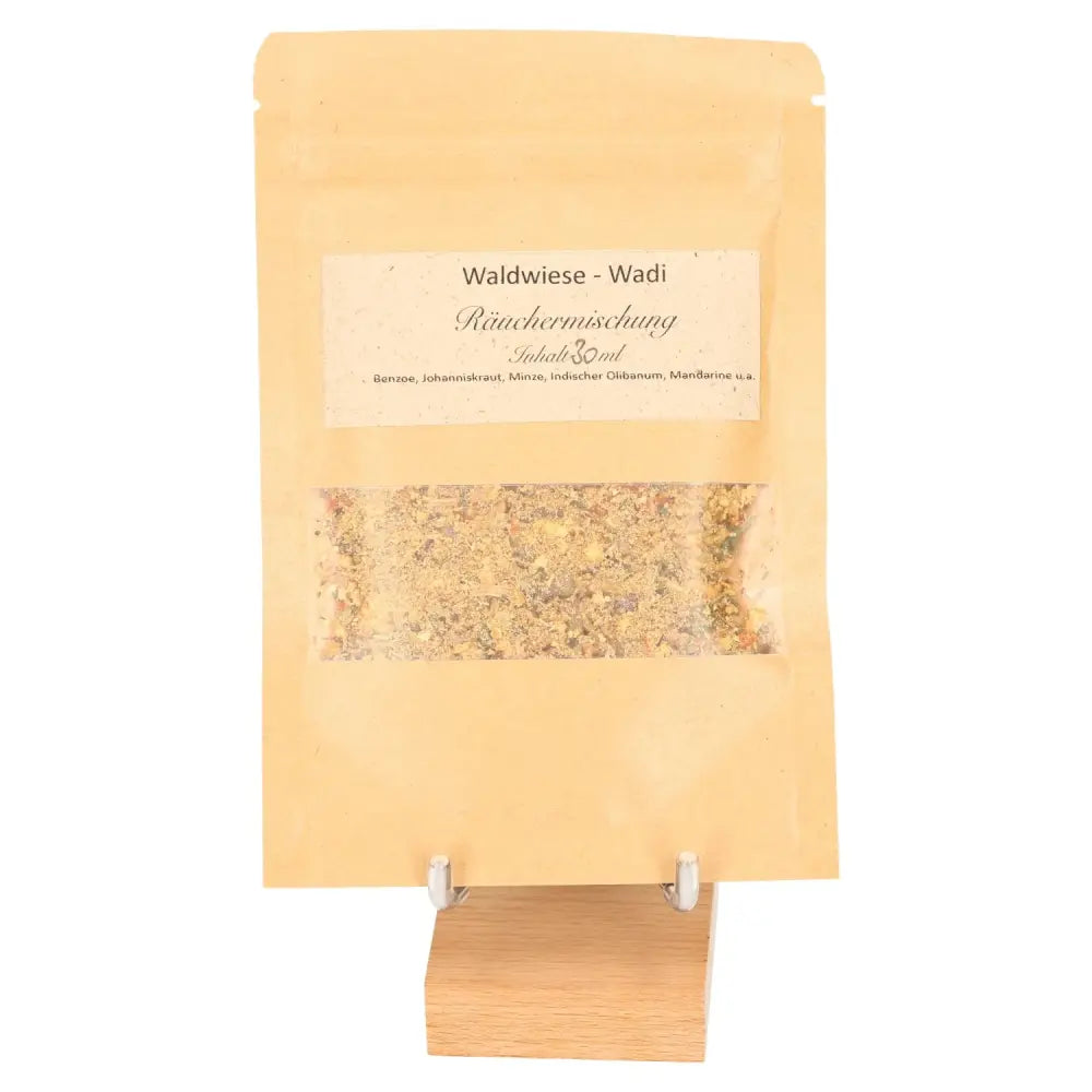Incense Blend 'Lightness' in a rustic pouch, offering a sweet aroma of mandarin and damar resin, evoking a sunlit forest clearing.