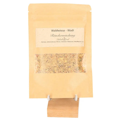 Incense Blend 'Lightness' in a rustic pouch, offering a sweet aroma of mandarin and damar resin, evoking a sunlit forest clearing.