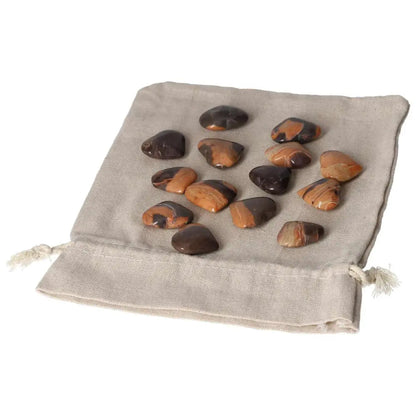 Jasper Tiger small heart stones on a linen pouch promoting harmony, peace, and positive energy for improved well-being.
