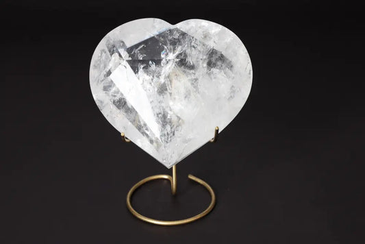 Lemurian Quartz Geometric Heart on a stand showcasing its crystal clarity and geometric design for spiritual connection and luxury.