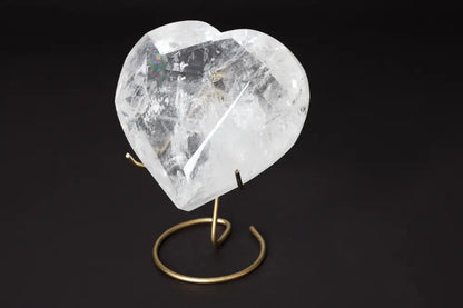 Lemurian Quartz Geometric Heart displayed on a stand, showcasing its clarity and intricate design.