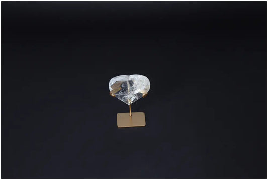 Lemurian Quartz Geometric Heart crystal on stand, showcasing clear quartz properties for purification and negative energy absorption.