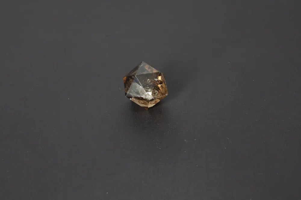 Lemurian Quartz geometric sphere on black background, showcasing sacred geometry and ancient wisdom attributes, 3.5 cm size.