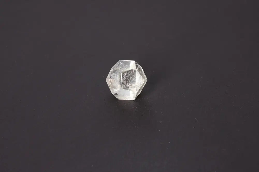 Lemurian Quartz Geometric Sphere 3.5 cm showcasing sacred geometry and ancient wisdom on a dark background.