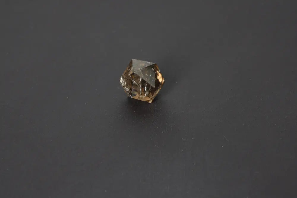 Lemurian Quartz geometric sphere on a dark background, showcasing sacred geometry and ethereal clarity.