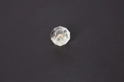 Lemurian Quartz geometric sphere on dark background, showcasing its clarity and sacred geometry for spiritual connection and ancient wisdom.