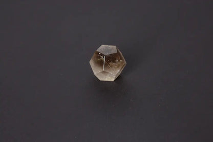 Lemurian Quartz Sphere in geometric shape with ethereal clarity on black background, 4 cm sacred geometry crystal for spiritual awakening.