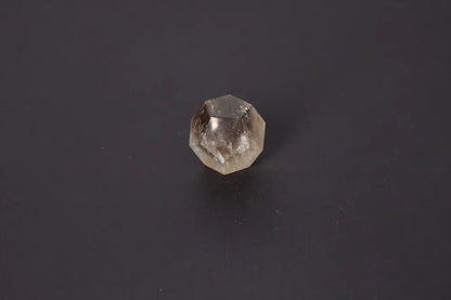 Lemurian Quartz Geometric Sphere with sacred geometry, showcasing natural clarity and horizontal striations, 4 cm size on a dark background.