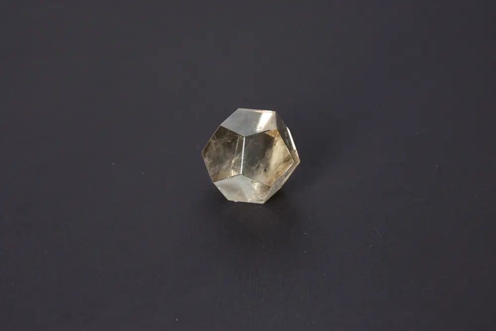 Lemurian Quartz geometric sphere, 4.5 cm, showcasing sacred geometry and ancient wisdom against a dark background.