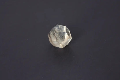 Lemurian Quartz Geometric Sphere 4.5 cm on dark background showcasing sacred geometry and ancient wisdom attributes.