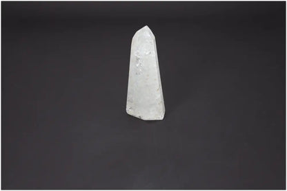 Lemurian Quartz Obelisk by Sylvia Crystals, premium energy harmonizing crystal against dark background.