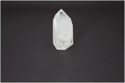 Lemurian Quartz Obelisk on dark background, premium crystal for spiritual enrichment and purification, from Sylvia Crystals.