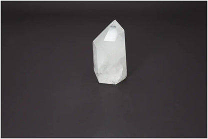Lemurian Quartz Obelisk on black background, highlighting its clear, crystalline structure. Perfect for energy purification and spiritual harmony.