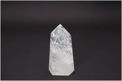 Lemurian Quartz Obelisk enhancing chakra alignment on a dark background; associated with energetic and spiritual properties.
