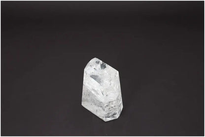 Lemurian Quartz Obelisk on black background, showcasing unique properties and associations with chakras and zodiac signs.