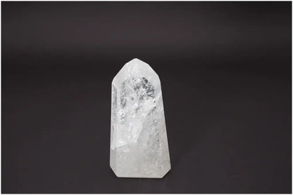 Lemurian Quartz Obelisk on black background, showcasing its clear crystalline structure for chakra and zodiac energy alignment.