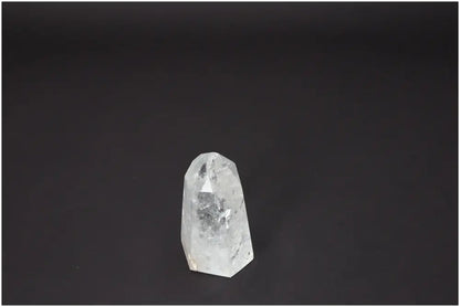 Lemurian Quartz Obelisk crystal with spiritual and energetic properties on a dark background, supporting chakra and zodiac alignment.