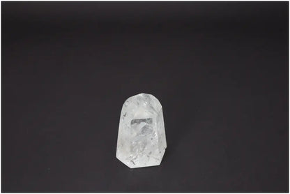 Lemurian Quartz Obelisk against black background, showcasing its clear crystal structure and spiritual energy properties.