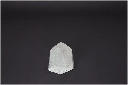 Lemurian Quartz Obelisk on dark background, highlighting its spiritual and energetic properties for chakra and zodiac sign support.