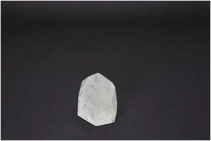 Lemurian Quartz Obelisk on dark background, showcasing unique properties for chakras and zodiac signs.