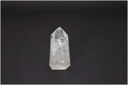 Lemurian Quartz Obelisk on dark background, a crystal known for chakra alignment and spiritual balance.