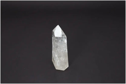 Lemurian Quartz Obelisk on black background, associated with chakras and zodiac signs, enhancing spiritual and energetic properties.