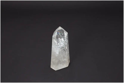 Lemurian Quartz Obelisk against dark background, showcasing its spiritual and energetic properties for chakra and zodiac support.