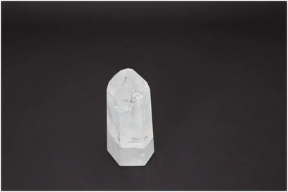 Lemurian Quartz Obelisk on a dark background, showcasing its clarity and potential energetic properties for chakra and zodiac support.