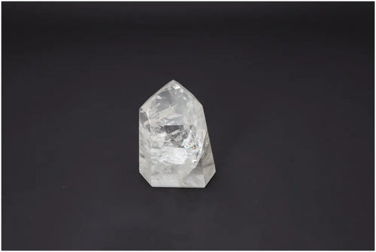Lemurian Quartz Obelisk on dark background, showcasing unique energetic properties for chakra and zodiac alignment.