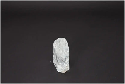 Lemurian Quartz Obelisk on black background, showcasing its unique spiritual properties and connection to chakras and zodiac signs.