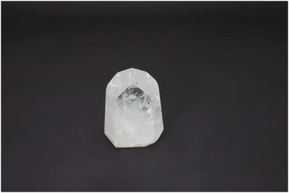 Lemurian Quartz Obelisk on dark background displaying natural clarity and spiritual properties for chakras and zodiac alignment.