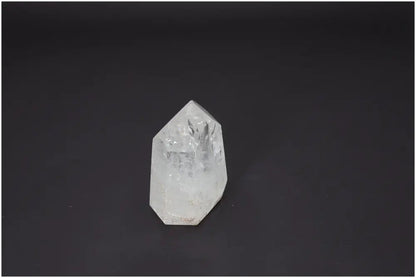 Lemurian Quartz Obelisk against black background, showcasing unique crystal properties for chakra balancing and spiritual energy support.