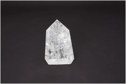 Lemurian Quartz Obelisk on dark background, showcasing clear crystal structure with spiritual and energetic properties for chakras.