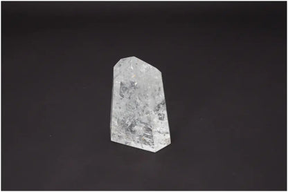 Lemurian Quartz Obelisk on a dark background symbolizing spiritual and energetic properties associated with chakras and zodiac signs.
