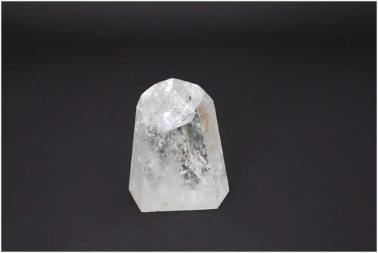 Lemurian Quartz Obelisk against dark background, showcasing its unique color and energetic properties for chakra and zodiac alignment.