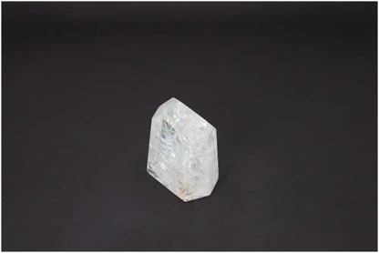 Lemurian Quartz Obelisk against a dark background, showcasing its unique properties and association with chakras and zodiac signs.